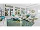 Bright and airy living room with a comfortable sectional sofa and large windows at 15407 Castle Park Ter, Lakewood Ranch, FL 34202