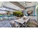 Expansive outdoor dining area with pool and lake views at 15407 Castle Park Ter, Lakewood Ranch, FL 34202