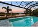 Relaxing pool area with lake views at sunset at 15407 Castle Park Ter, Lakewood Ranch, FL 34202
