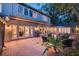 Spacious backyard with a brick patio, outdoor seating, and manicured landscaping at 1656 Hillview St, Sarasota, FL 34239