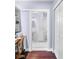 Bathroom with white fixtures, black and white tiled floor, and built-in storage at 1656 Hillview St, Sarasota, FL 34239