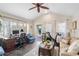 Home office/den with a desk, couch, exercise bike, and access to the backyard at 1656 Hillview St, Sarasota, FL 34239