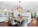 Stylish kitchen with a large island, ample counter space, and hardwood floors at 1656 Hillview St, Sarasota, FL 34239