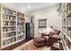 Cozy library with built-in bookshelves, a reading nook, and a wine fridge at 1656 Hillview St, Sarasota, FL 34239
