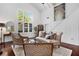 Bright living room with vaulted ceilings, large windows, and stylish furniture at 1656 Hillview St, Sarasota, FL 34239