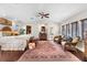 Spacious main bedroom with walk-in closet, ensuite bathroom, and sitting area at 1656 Hillview St, Sarasota, FL 34239