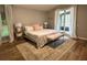 Bright main bedroom with a king-size bed and access to a private patio at 19025 Fern Meadow Loop, Lutz, FL 33558