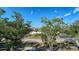 Aerial view of a community with lush landscaping and ample parking at 1904 Harbourside Dr # 204, Longboat Key, FL 34228