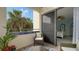 Relaxing balcony with patio furniture and view of tropical landscape at 1904 Harbourside Dr # 204, Longboat Key, FL 34228