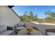 Relaxing balcony with wicker furniture and a scenic view at 1904 Harbourside Dr # 204, Longboat Key, FL 34228