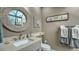 Stylish bathroom with a vessel sink and decorative mirror at 1904 Harbourside Dr # 204, Longboat Key, FL 34228