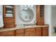 Spa-like bathroom featuring a large vanity with granite countertops at 1904 Harbourside Dr # 204, Longboat Key, FL 34228