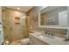 Clean bathroom, featuring a large shower and granite countertop at 1904 Harbourside Dr # 204, Longboat Key, FL 34228