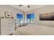 Bright bedroom with a comfortable bed and dresser at 1904 Harbourside Dr # 204, Longboat Key, FL 34228