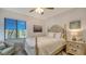 Bright bedroom with a queen-size bed and nightstand at 1904 Harbourside Dr # 204, Longboat Key, FL 34228