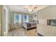 Guest bedroom with twin-over-twin bunk beds and rocking chair at 1904 Harbourside Dr # 204, Longboat Key, FL 34228