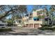 Front view of the building, showing multiple units and parking at 1904 Harbourside Dr # 204, Longboat Key, FL 34228