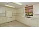 Community kitchen with appliances and cabinets at 1904 Harbourside Dr # 204, Longboat Key, FL 34228