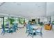 Community room with seating and tables at 1904 Harbourside Dr # 204, Longboat Key, FL 34228