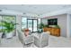 Relaxing community room with seating and TV at 1904 Harbourside Dr # 204, Longboat Key, FL 34228