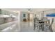 Bright dining area with a table and chairs, and an open floor plan at 1904 Harbourside Dr # 204, Longboat Key, FL 34228