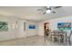 Open concept dining area with coastal artwork and hardwood floors at 1904 Harbourside Dr # 204, Longboat Key, FL 34228