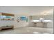Casual dining area with breakfast bar and coastal decor at 1904 Harbourside Dr # 204, Longboat Key, FL 34228