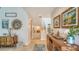 Bright and airy entryway with coastal decor and staircase at 1904 Harbourside Dr # 204, Longboat Key, FL 34228