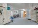 Garage with bikes, storage shelving and access to other rooms at 1904 Harbourside Dr # 204, Longboat Key, FL 34228