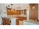 Modern kitchen with wood cabinets and granite countertops at 1904 Harbourside Dr # 204, Longboat Key, FL 34228