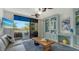 Cozy living room with a comfy sofa and built-in shelving at 1904 Harbourside Dr # 204, Longboat Key, FL 34228
