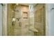 Updated shower with glass enclosure and built-in seat at 1904 Harbourside Dr # 204, Longboat Key, FL 34228