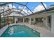 Screened pool and patio with comfortable seating area at 2077 Apalachee Ln, Nokomis, FL 34275