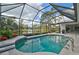 Relaxing pool with a screened enclosure and lake view at 2077 Apalachee Ln, Nokomis, FL 34275