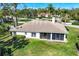 Aerial view of home showcasing the backyard, mature trees, and lanai at 2960 Sandringham Pl, Sarasota, FL 34235