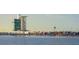Vibrant beach scene with crowds enjoying the waterfront and a modern building in the background at 2960 Sandringham Pl, Sarasota, FL 34235