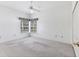 Bright and spacious bedroom featuring large window, providing ample natural light at 2960 Sandringham Pl, Sarasota, FL 34235