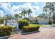 Welcoming Sandringham Place entrance with manicured landscaping and a beautiful sign, adding charm and curb appeal at 2960 Sandringham Pl, Sarasota, FL 34235
