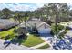 Beautiful single-story home with a tile roof, two-car garage, and lush landscaping at 2960 Sandringham Pl, Sarasota, FL 34235