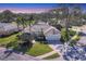 Beautiful single-story home with a tile roof, two-car garage, and lush landscaping at 2960 Sandringham Pl, Sarasota, FL 34235