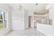 Bright open kitchen area featuring tile flooring, modern appliances, and ample counter space at 2960 Sandringham Pl, Sarasota, FL 34235