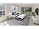 Stylishly decorated main bedroom with an exterior view and sliding door access to outdoor patio at 2960 Sandringham Pl, Sarasota, FL 34235