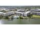 Aerial view of condo community by the lake with pool and dock at 3937 Lake Bayshore Dr # 401, Bradenton, FL 34205