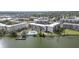 Aerial view of condos on the lake, showing a pool and pier for residents to enjoy at 3937 Lake Bayshore Dr # 401, Bradenton, FL 34205