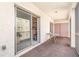 Enclosed balcony featuring neutral carpeting, slider, and storage; a serene space for relaxing and enjoying views at 3937 Lake Bayshore Dr # 401, Bradenton, FL 34205