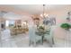 Open dining room with decorative chandelier and plenty of room for Gathering and friends at 3937 Lake Bayshore Dr # 401, Bradenton, FL 34205