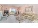 Cozy living room with waterfront view, comfortable furniture and decorative fireplace at 3937 Lake Bayshore Dr # 401, Bradenton, FL 34205