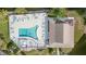 Top-down view of resort-style pool and deck at 3937 Lake Bayshore Dr # 401, Bradenton, FL 34205