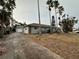 View of the home's driveway and garage at 461 S Florida Ave, Tarpon Springs, FL 34689