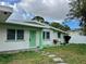 Ranch-style home with green accents and a well-maintained lawn at 4610 21St W St, Bradenton, FL 34207